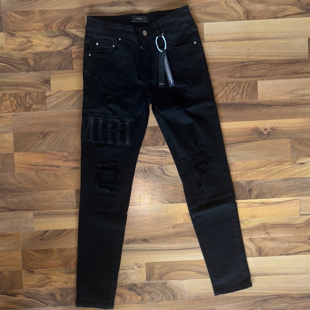 AMIRI Black Distressed Skinny Jeans with Embossed Logo